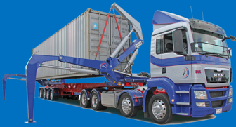 truck lifting a shipping container of the back
